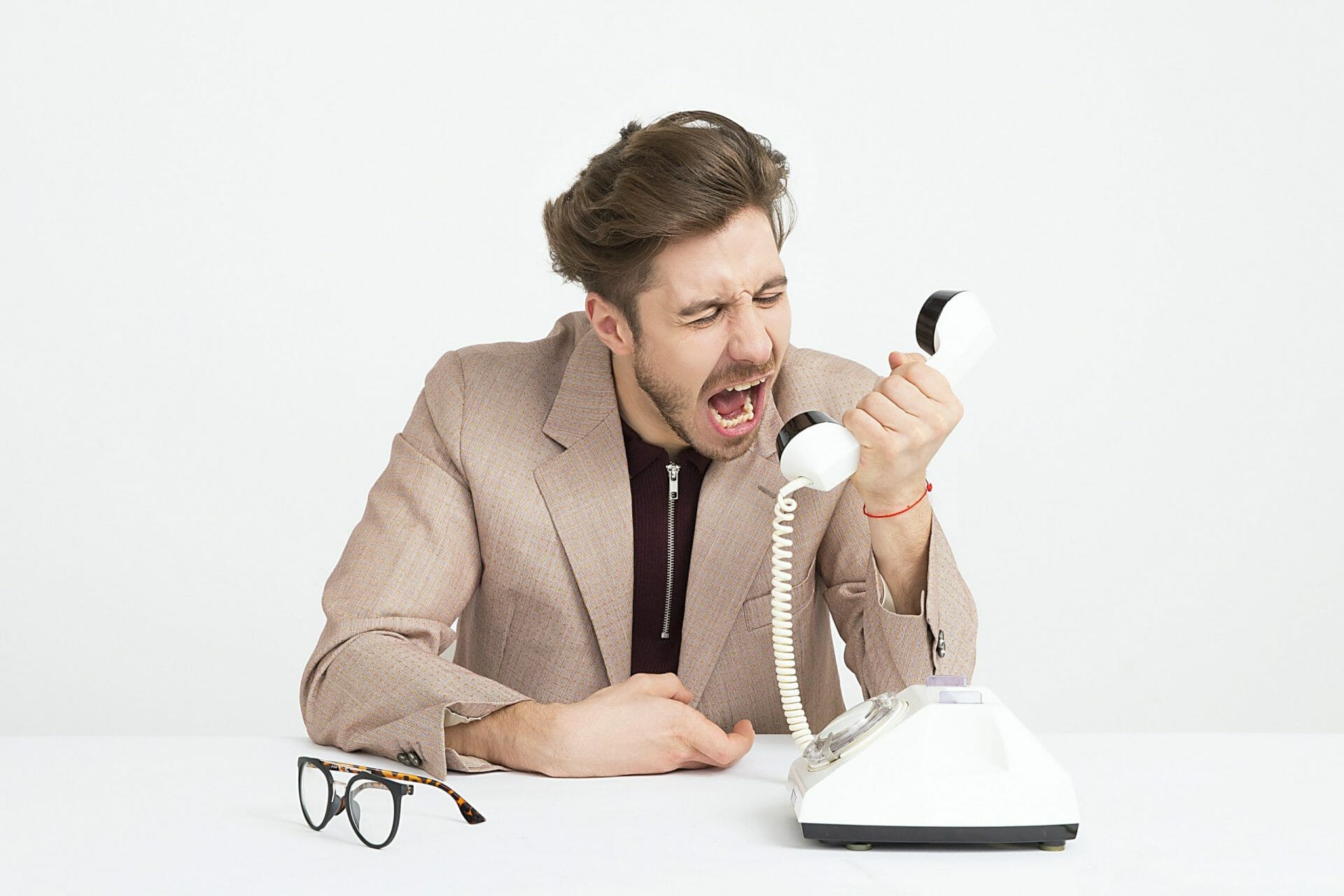 a man shouting down the phone to symbolise how to embrace change using emotional intelligence