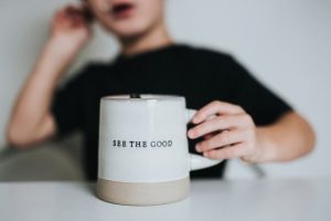 a mug saying see the good to represent how to overcome imposter syndrome at work